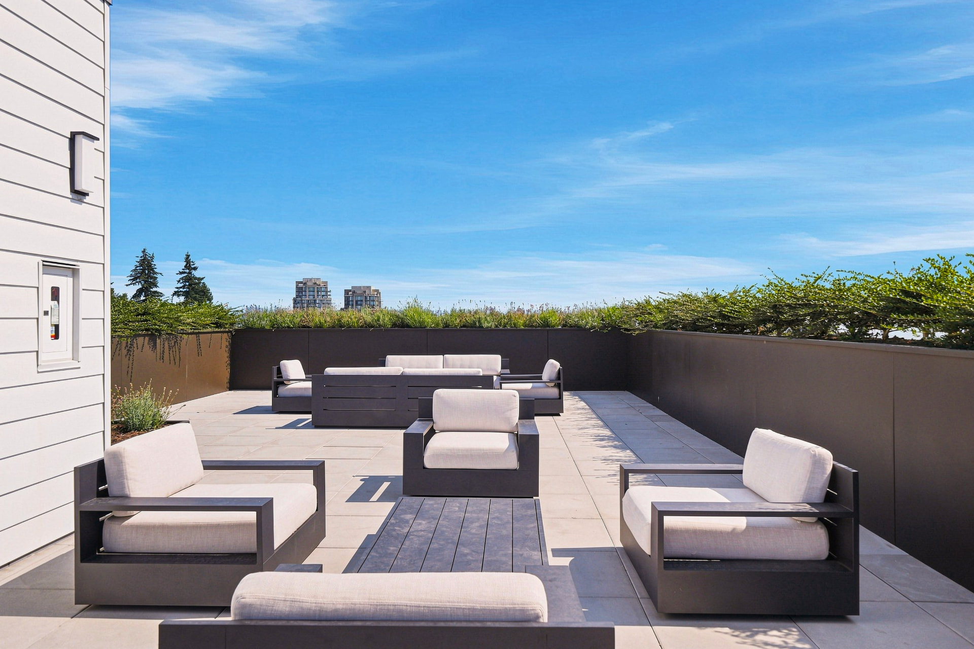 First & Royal rooftop terrace lounge seating with city views, New Westminster