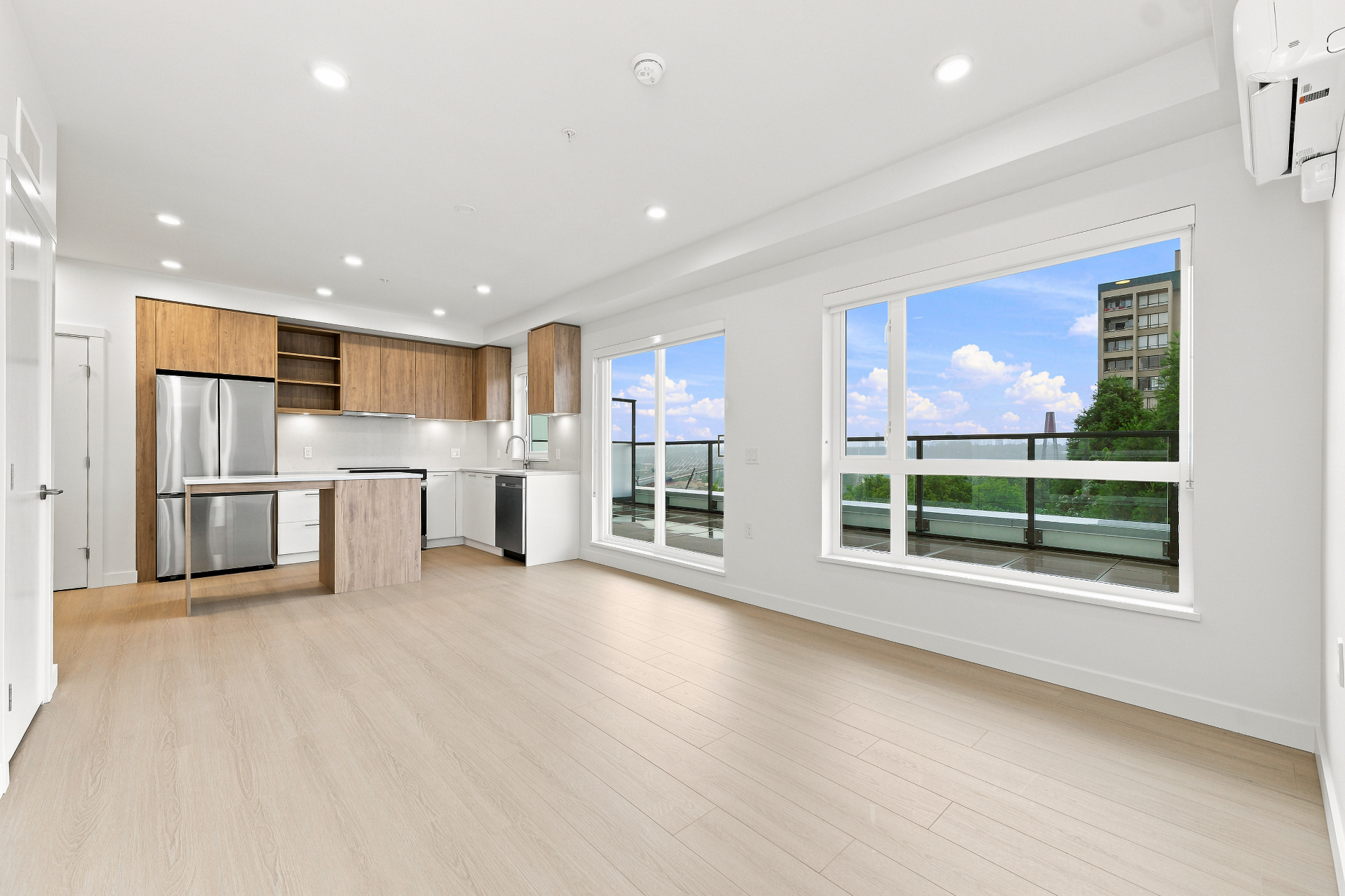 Brand-new kitchen with Samsung appliances and quartz countertops at First & Royal